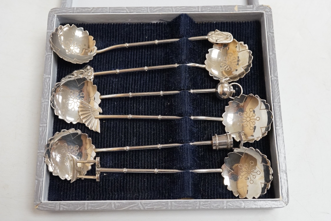 Three assorted silver christening sets including spoon, fork and napkin ring by William Hutton & Sons, London, 1896, one other set with steel knife, two cased sets of silver coffee spoons and a cased set of six Japanese